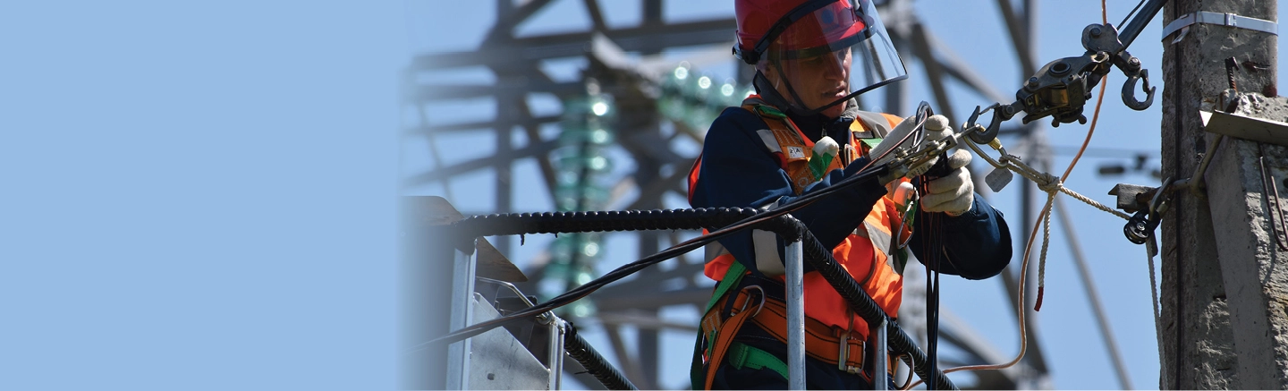 Worker fixing hydro power lines 